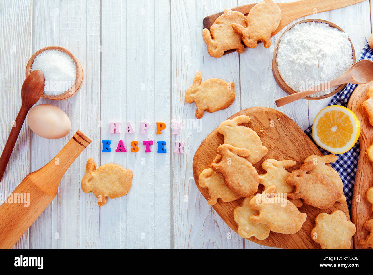 Happy Easter greeting. Baking Easter bunnies. Cookies with ingredients Stock Photo