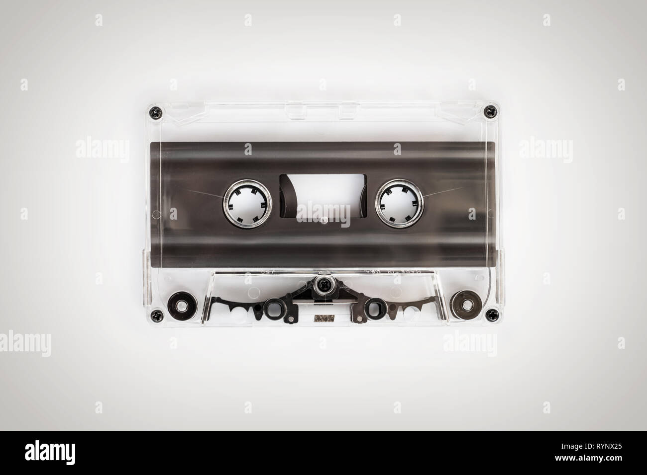 Translucent audio cassette tape on white background Stock Photo