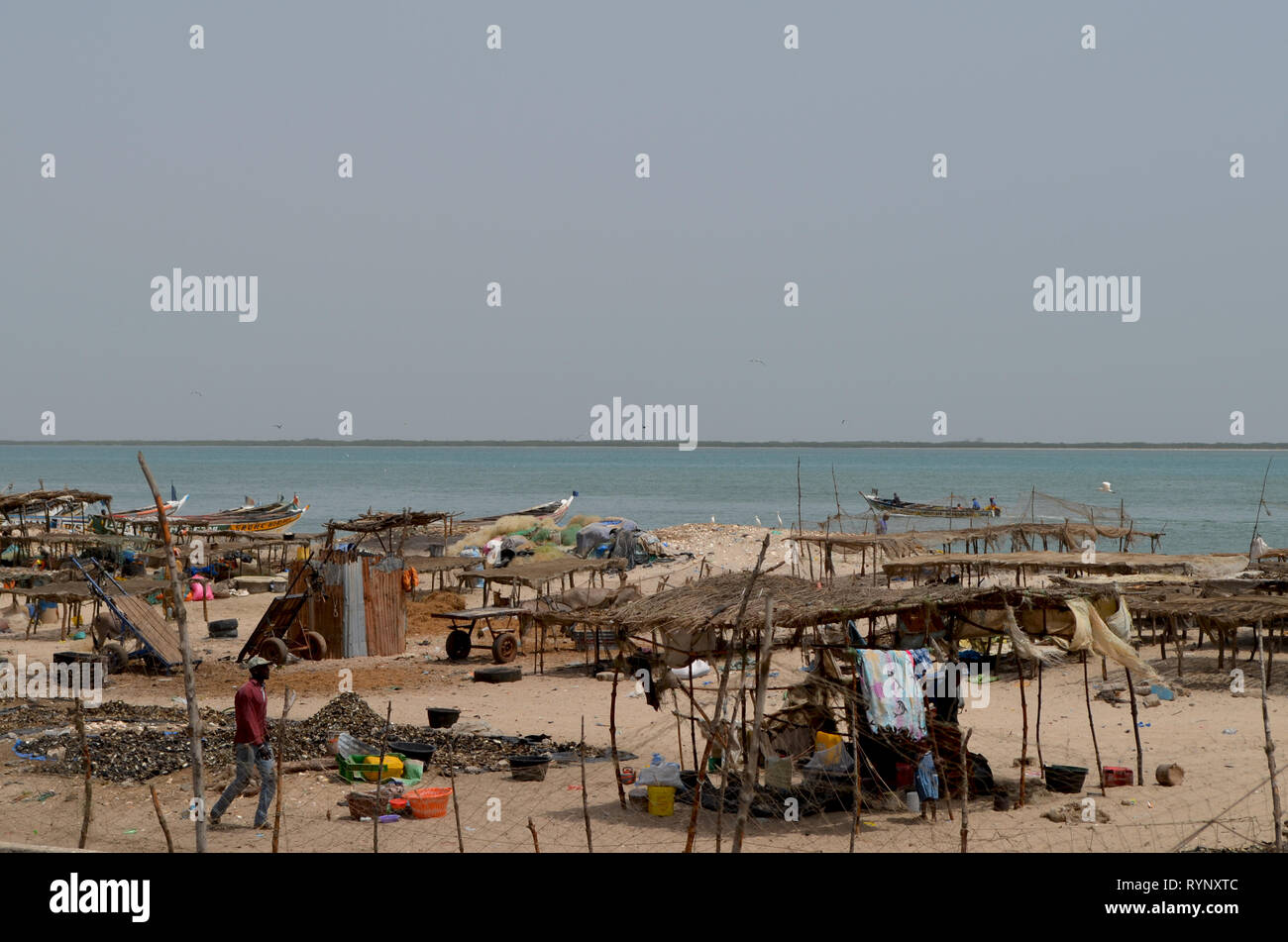 Sardinella landing and drying areas in the coastal village of Djiffère, Senegal Stock Photo