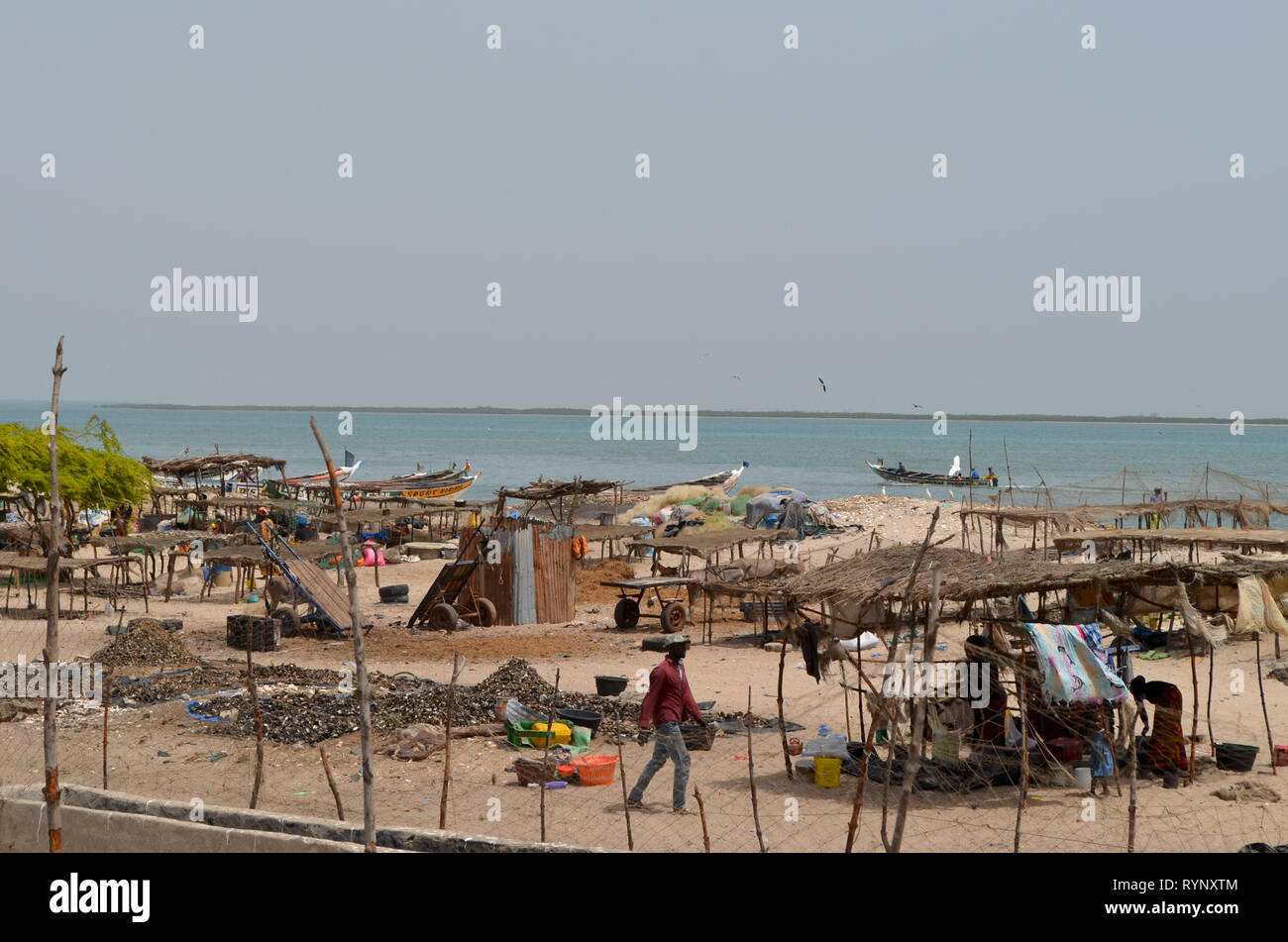 Sardinella landing and drying areas in the coastal village of Djiffère, Senegal Stock Photo