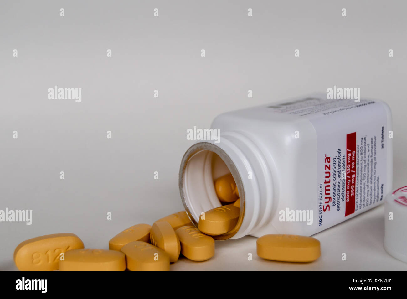 Chicago, USA-March 13, 2019: An open bottle of Symtuza prescription medication. The medicine is used to treat HIV infection and is taken once a day. Stock Photo