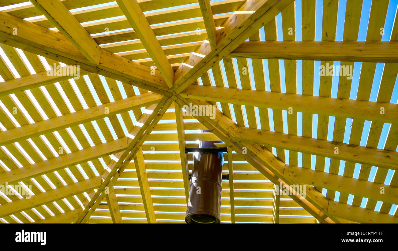 A shed that is made in lath cover. A thin flat strip of wood especially one of a series forming a foundation for the plaster of a wall or the tiles of Stock Photo