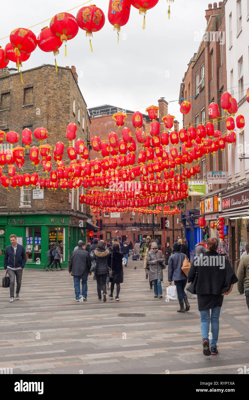 Tourists walk around the streets of Chinatown, London, UK Stock Photo