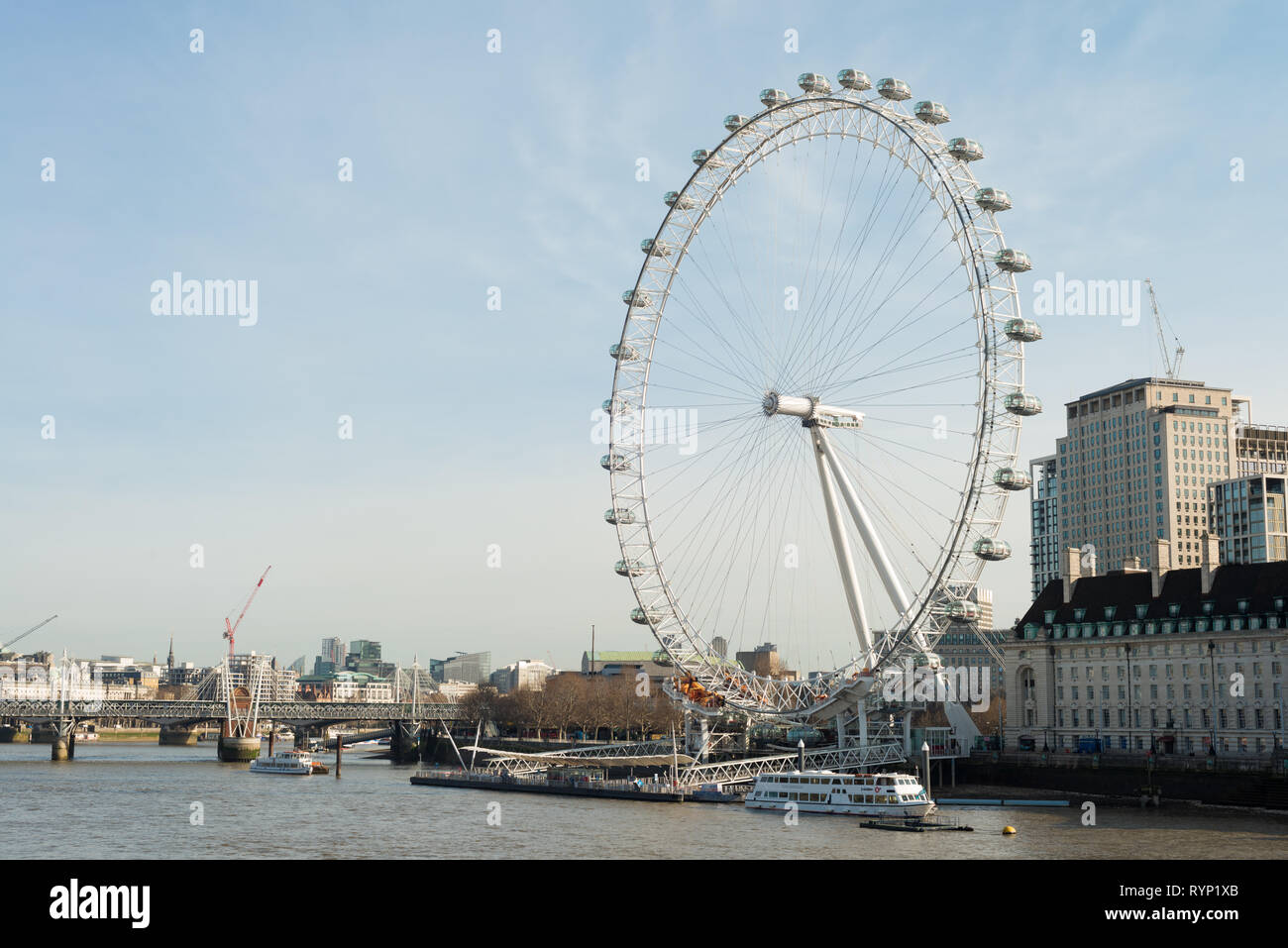 The London Eye tourist attraction on the banks of the River Thames, London, England, UK Stock Photo
