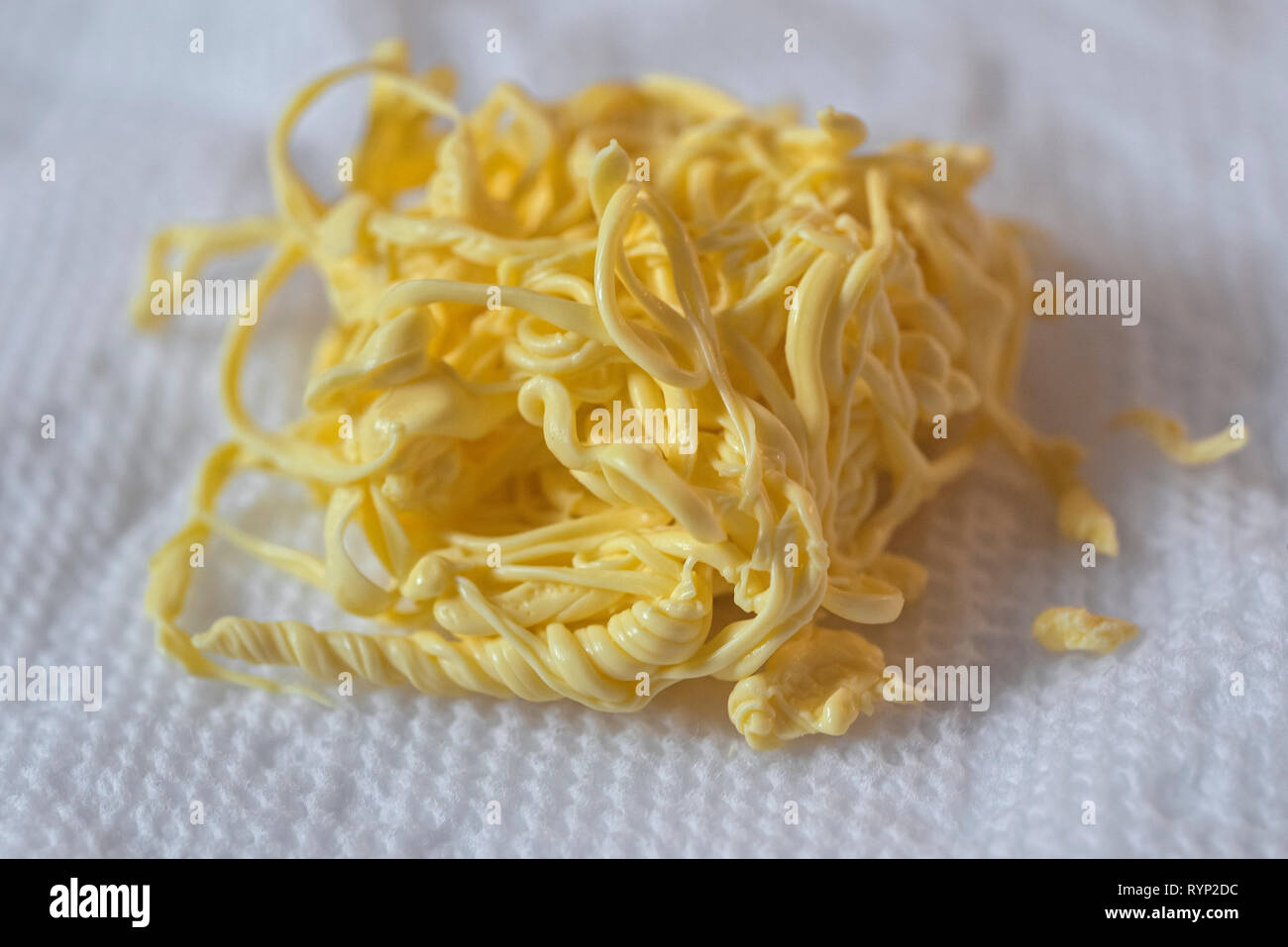 Mystery Food...better known as egg yokes forced out while boiling eggs. Stock Photo