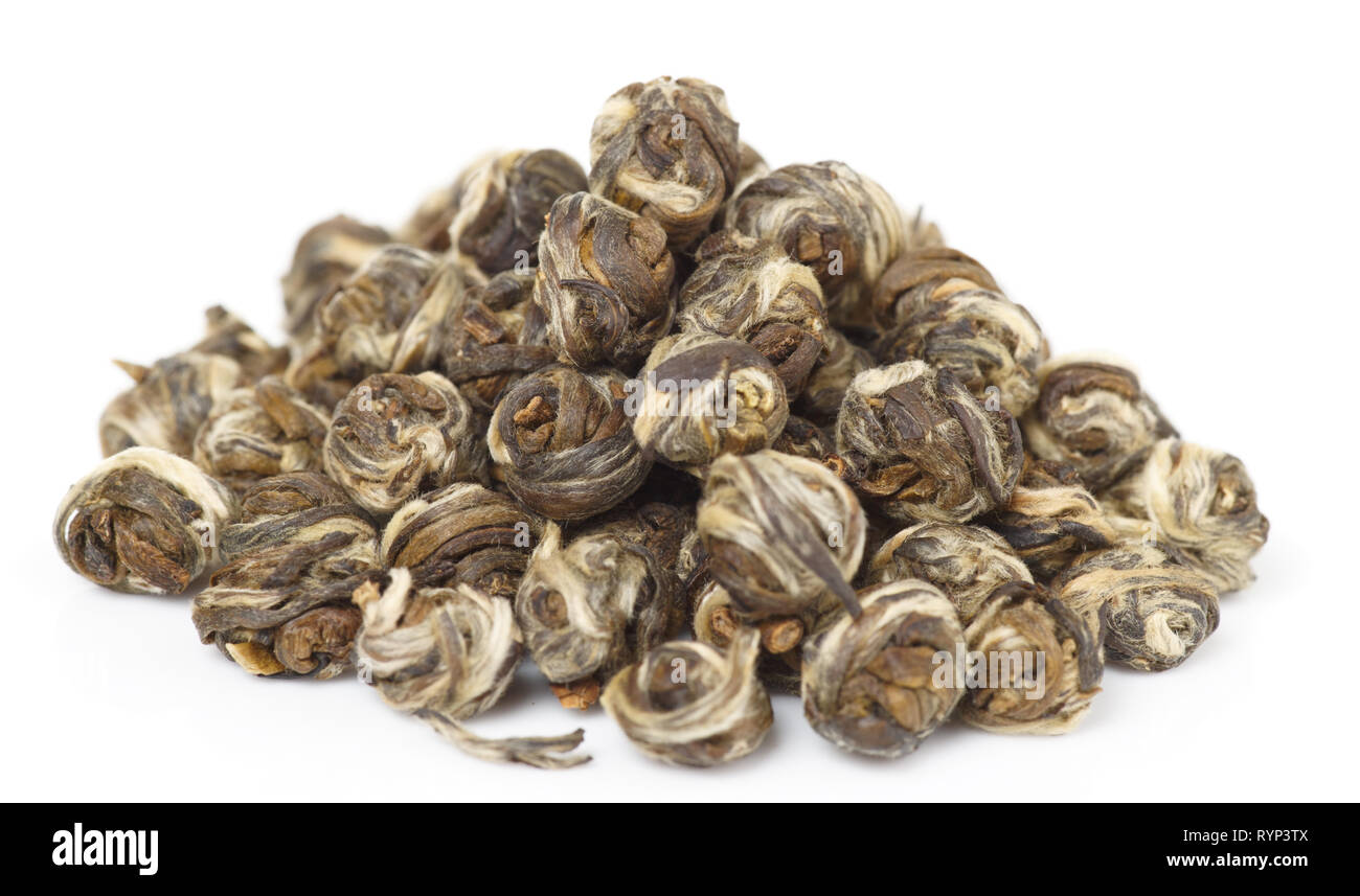 Heap of elite whole leaf oolong tea isolated on pure white with subtle shadows Stock Photo