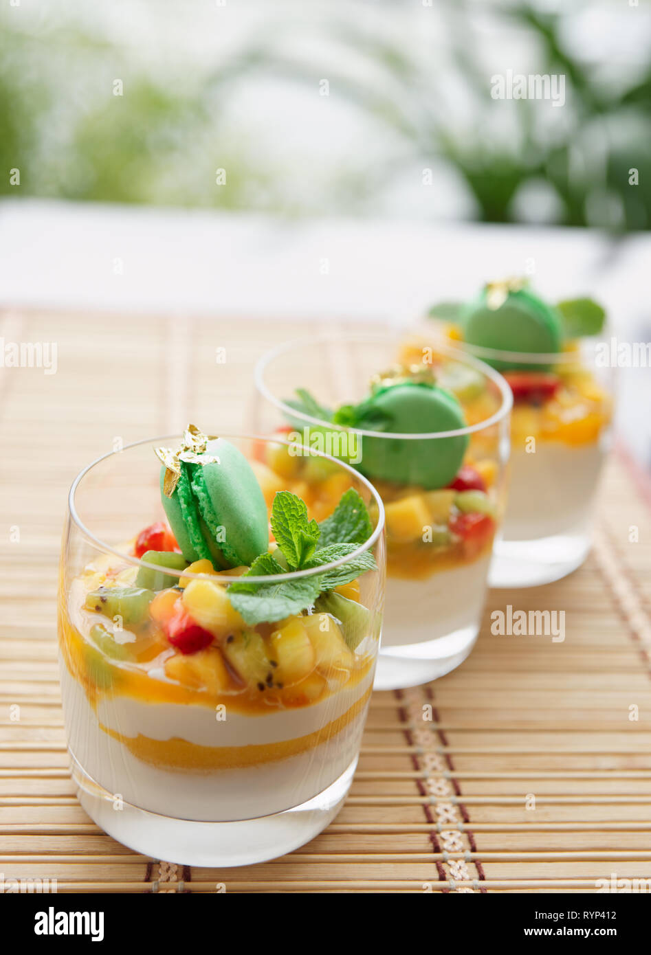 Three fruit cocktails on a summer restaurant lounge, copy space Stock