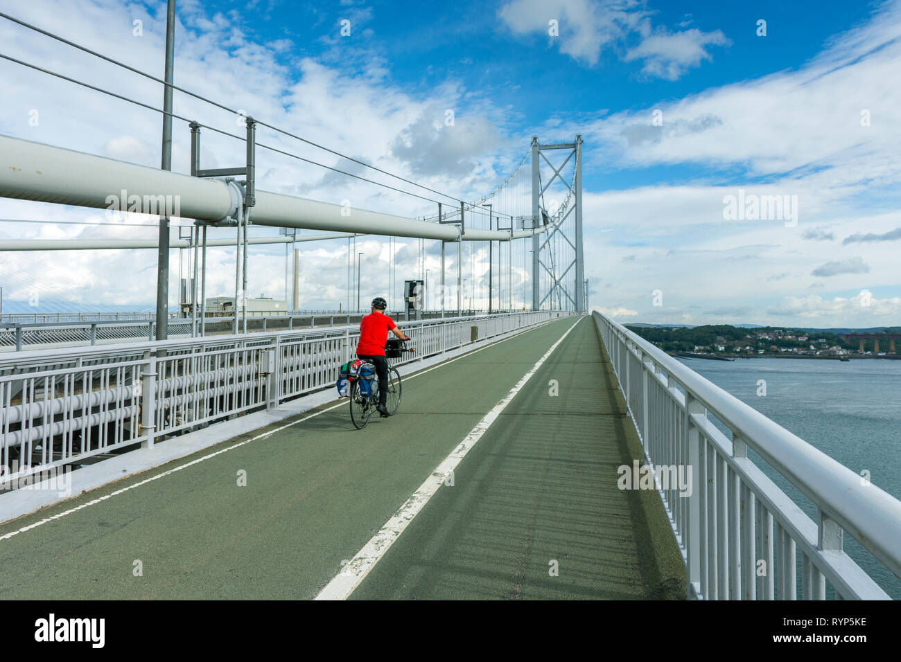 A cyclist on the Forth Road Bridge, Queensferry, Edinburgh, Scotland, UK Stock Photo