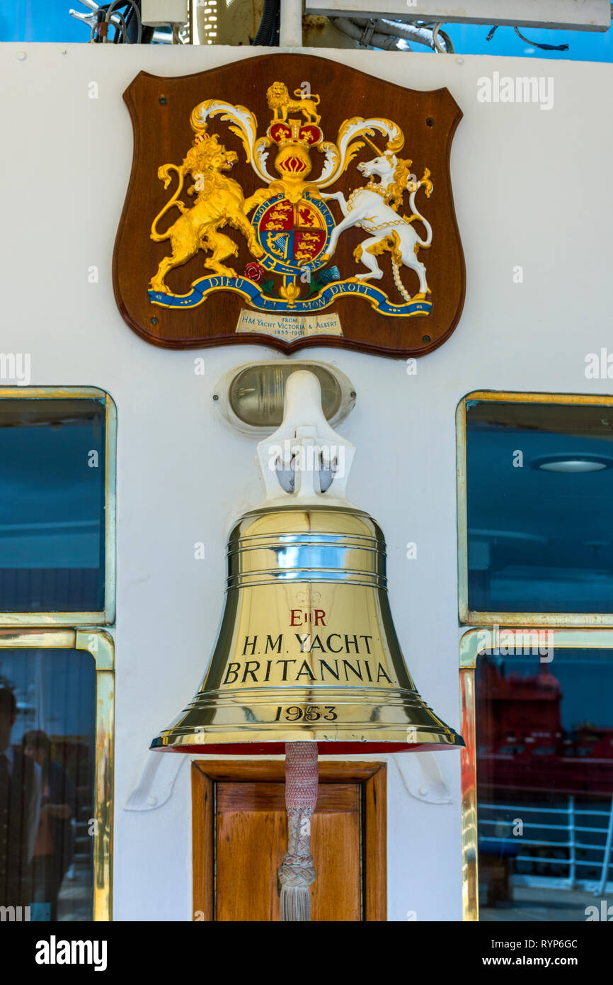 The bell and coat of arms on the Royal Yacht Britannia, Port of Leith, Edinburgh, Scotland, UK Stock Photo