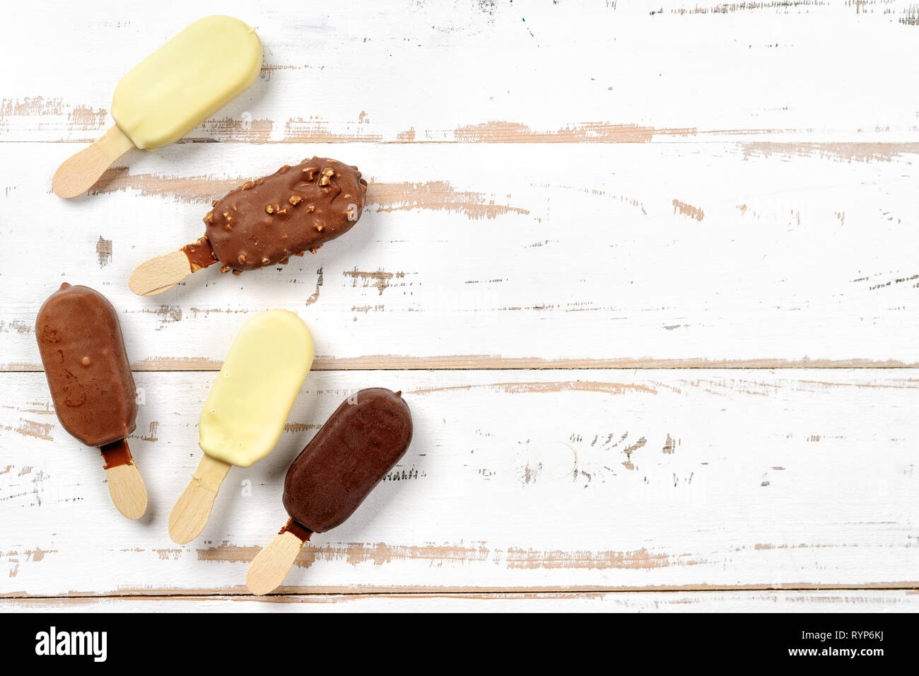 Top view of ice cream popsicles covered with chocolate Stock Photo