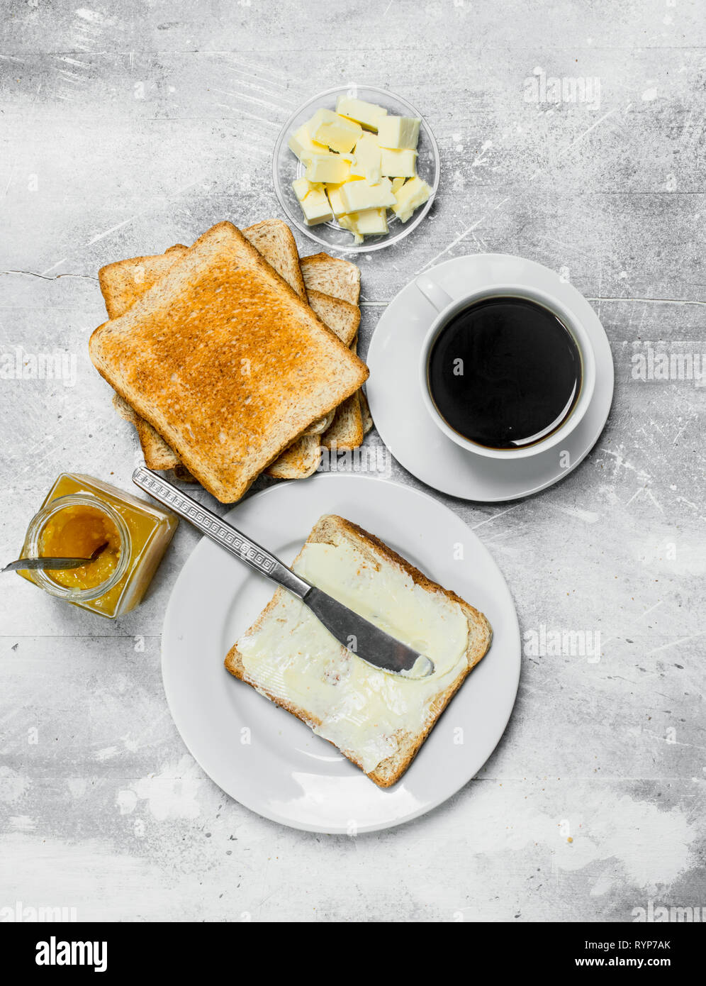 Toasted Bread With Butter And Hot Coffee On A Rustic Background Stock Photo Alamy