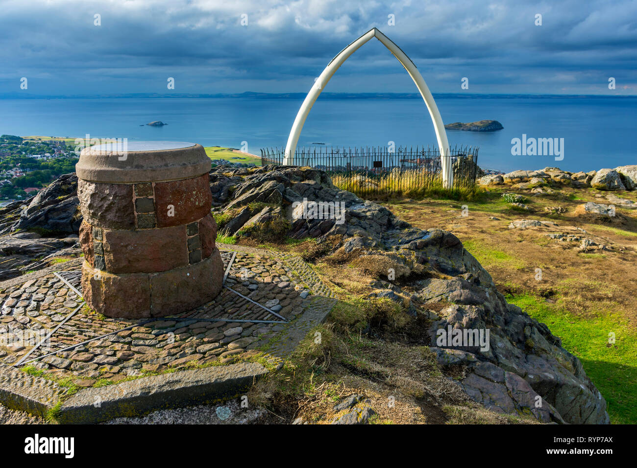 The toposcope (viewpoint indicator) and replica whale bones on the summit of North Berwick Law, East Lothian, Scotland, UK Stock Photo
