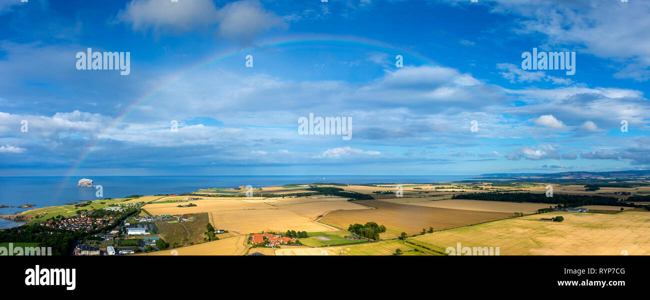 The Bass Rock and rainbow from the summit of North Berwick Law, East Lothian, Scotland, UK Stock Photo