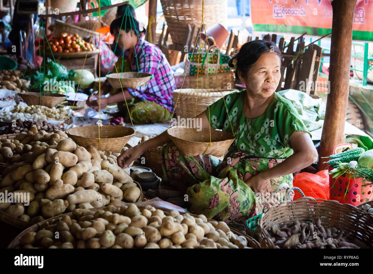 Vegetable seller at Nyaung U market near Bagan in Myanmar Stock Photo
