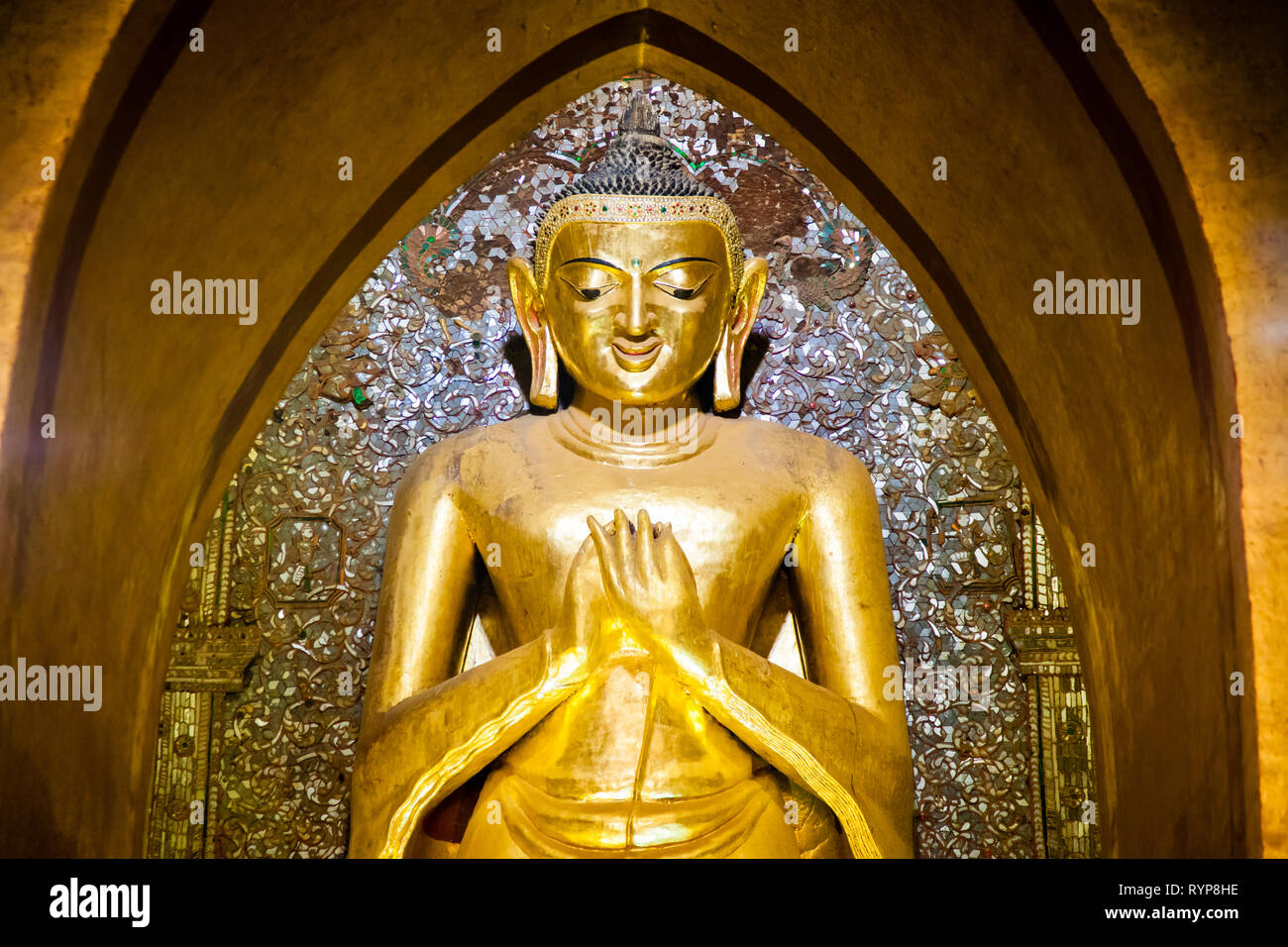 Gold buddha statue inside Ananda pagoda at Bagan in Myanmar Stock Photo