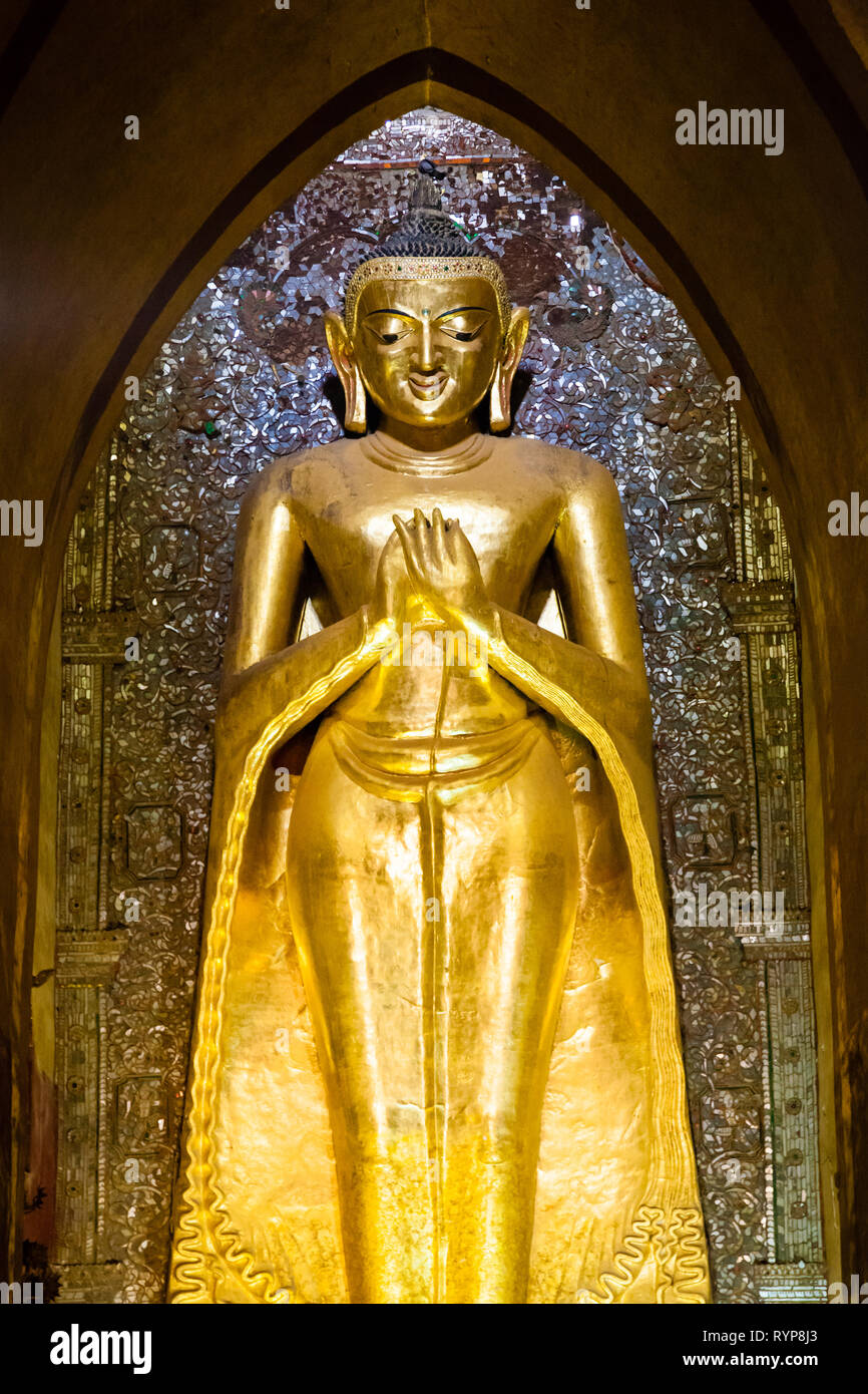 Gold buddha statue inside Ananda pagoda at Bagan in Myanmar Stock Photo