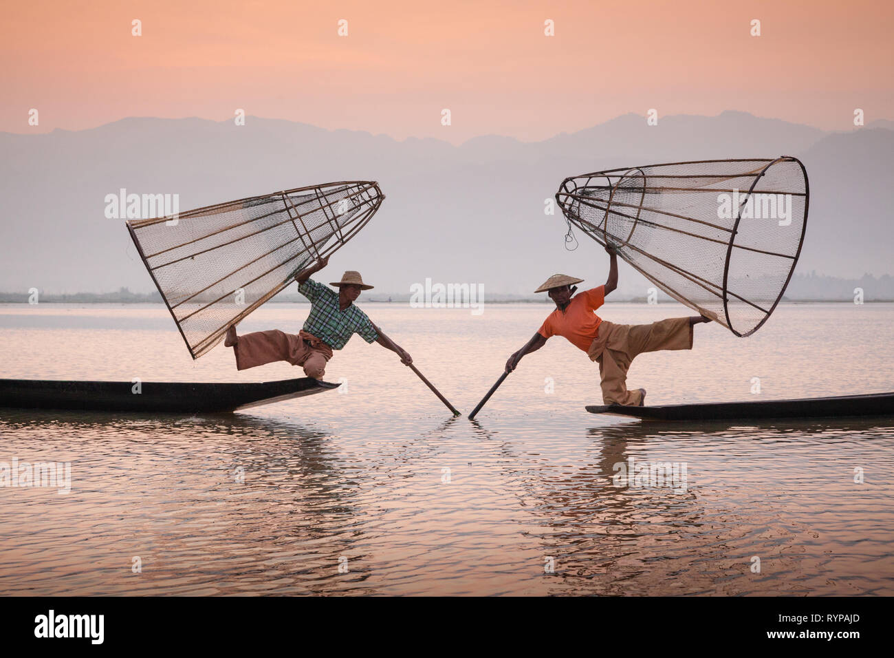 The famous leg-rowing fishermen of Inle Lake, Myanmar Stock Photo