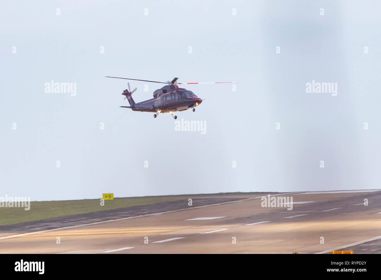 Leeds, UK. 14th Mar, 2019. The Queen's helicopter (registered G-XXEB) battled strong winds to land at Leeds Bradford Airport this afternoon. It is not known whether a member of the Royal Family was on board the helicopter but, according to the Royal Calendar, Prince Edward is carrying out official engagements in West Yorkshire today. Credit: James Copeland/Alamy Live News Stock Photo