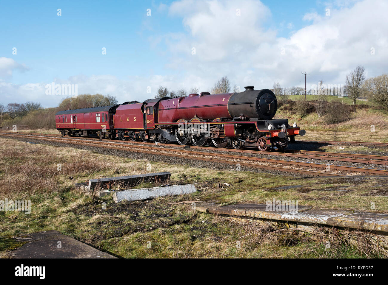Hellifield, North Yorkshire, UK. 14th Mar 2019. Steam locomotive 6201 'Princess Elizabeth' arrives at Hellifield Station; North Yorkshire; on a mainline test run from it's base at Carnforth; Lancashire. The locomotive was built in 1933 and was named after the then Princess Elizabeth; the current Queen Elizabeth II. The locomotive has recently been restored for mainline railway service. Credit: John Bentley/Alamy Live News Stock Photo