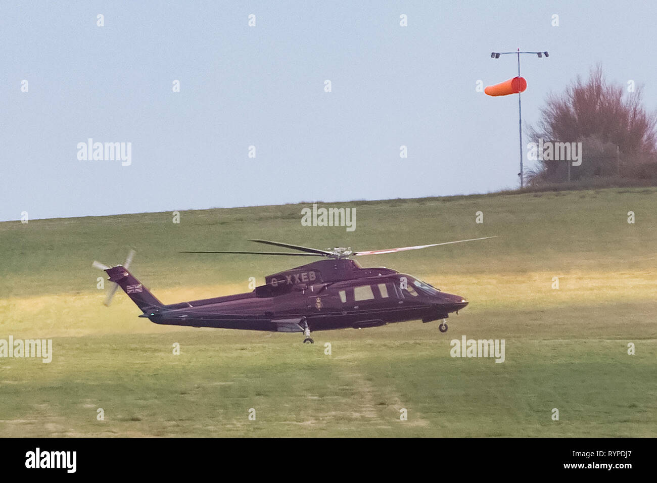 Leeds, UK. 14th Mar, 2019. The Queen's helicopter (registered G-XXEB) battled strong winds to land at Leeds Bradford Airport this afternoon. It is not known whether a member of the Royal Family was on board the helicopter but, according to the Royal Calendar, Prince Edward is carrying out official engagements in West Yorkshire today. Credit: James Copeland/Alamy Live News Stock Photo