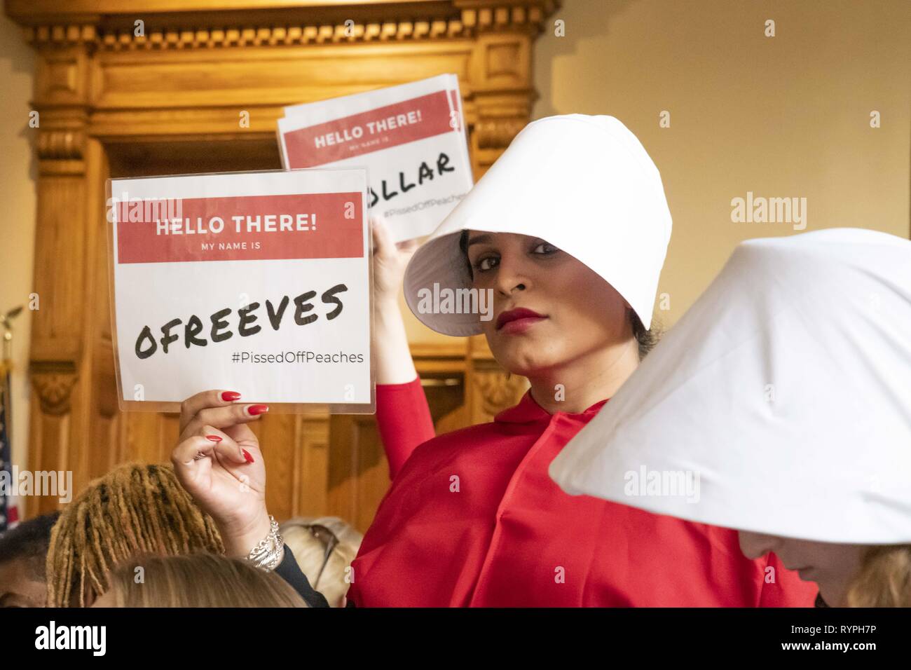 Atlanta, Georgia, USA. 14th Mar, 2019. Dozens of pro-choice protesters demonstrated against the ''heartbeat bill'' legislation at the Georgia State Capitol building. The legislation would ban most abortions after six weeks. The protest was organized by several groups including Handmaids Unite - Georgia. Several protesters dressed as characters from the book The Handmaid's Tale. Credit: Steve Eberhardt/ZUMA Wire/Alamy Live News Stock Photo