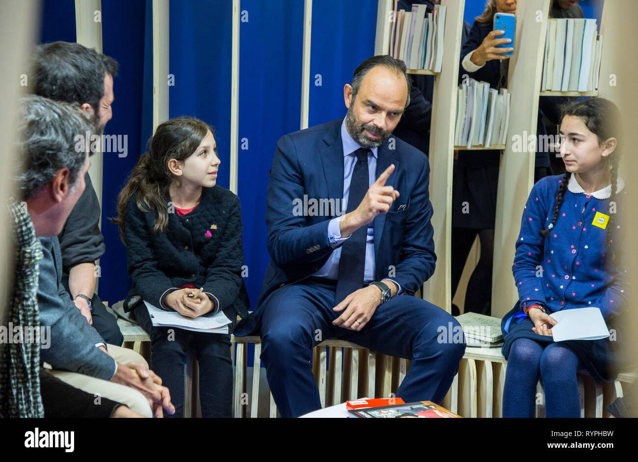 French Prime Minister Edouard Philippe seen speaking with child during his visit at the 2019 Paris Book Fair. Stock Photo