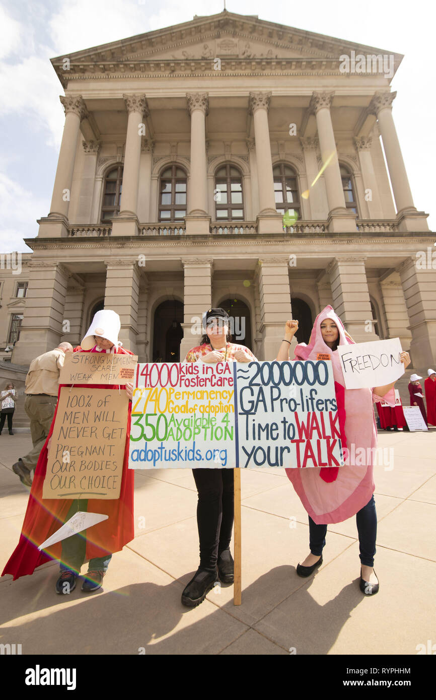 Atlanta, Georgia, USA. 14th Mar, 2019. Dozens of pro-choice protesters demonstrated against the ''heartbeat bill'' legislation at the Georgia State Capitol building. The legislation would ban most abortions after six weeks. The protest was organized by several groups including Handmaids Unite - Georgia. Several protesters dressed as characters from the book The Handmaid's Tale. Credit: Steve Eberhardt/ZUMA Wire/Alamy Live News Stock Photo