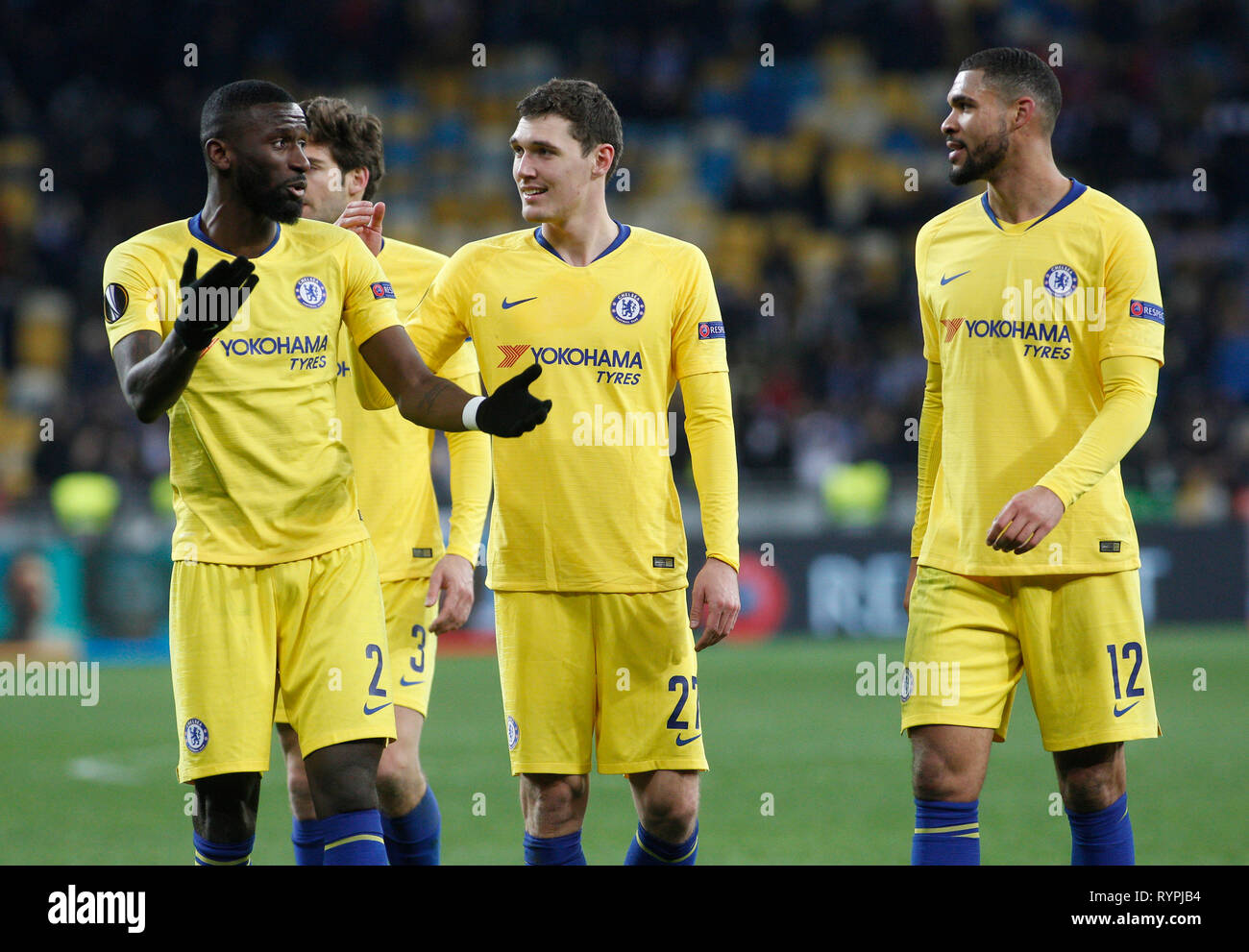 Antonio Ruediger (L) and Andreas Christiansen (C) celebrate after the Europa League second play-off soccer match between FC Dynamo Kyiv and FC Chelsea, at the Olimpiyskyi stadium. Final score: Dynamo Kyiv 0 - 5 Chelsea Stock Photo