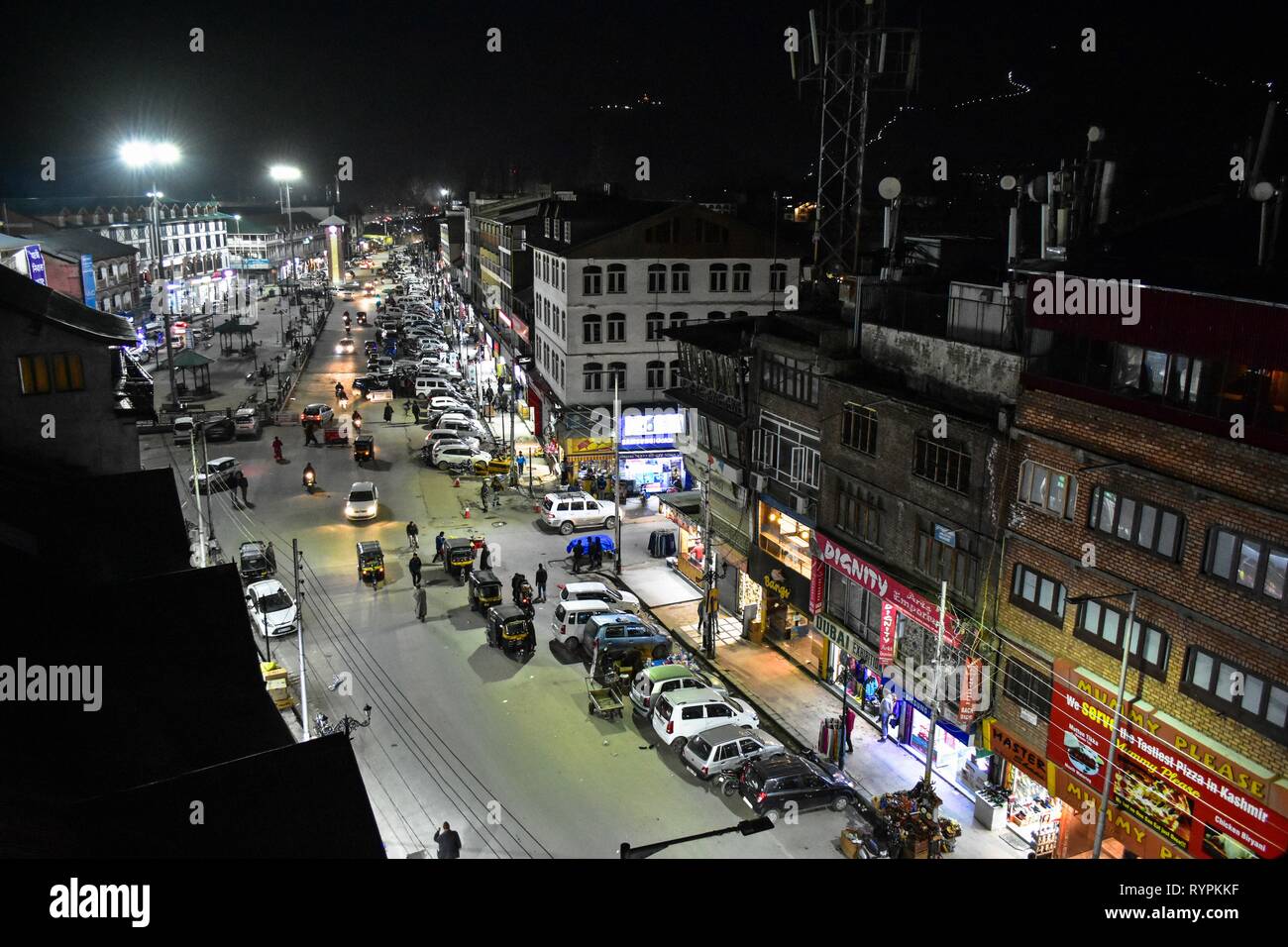 People seen busy shopping at a commercial hub Lal chowk during night hours in Srinagar, Kashmir. Kashmir is the northernmost geographical region of the Indian subcontinent. It is currently a disputed territory, administered by three countries: India, Pakistan and China. Stock Photo