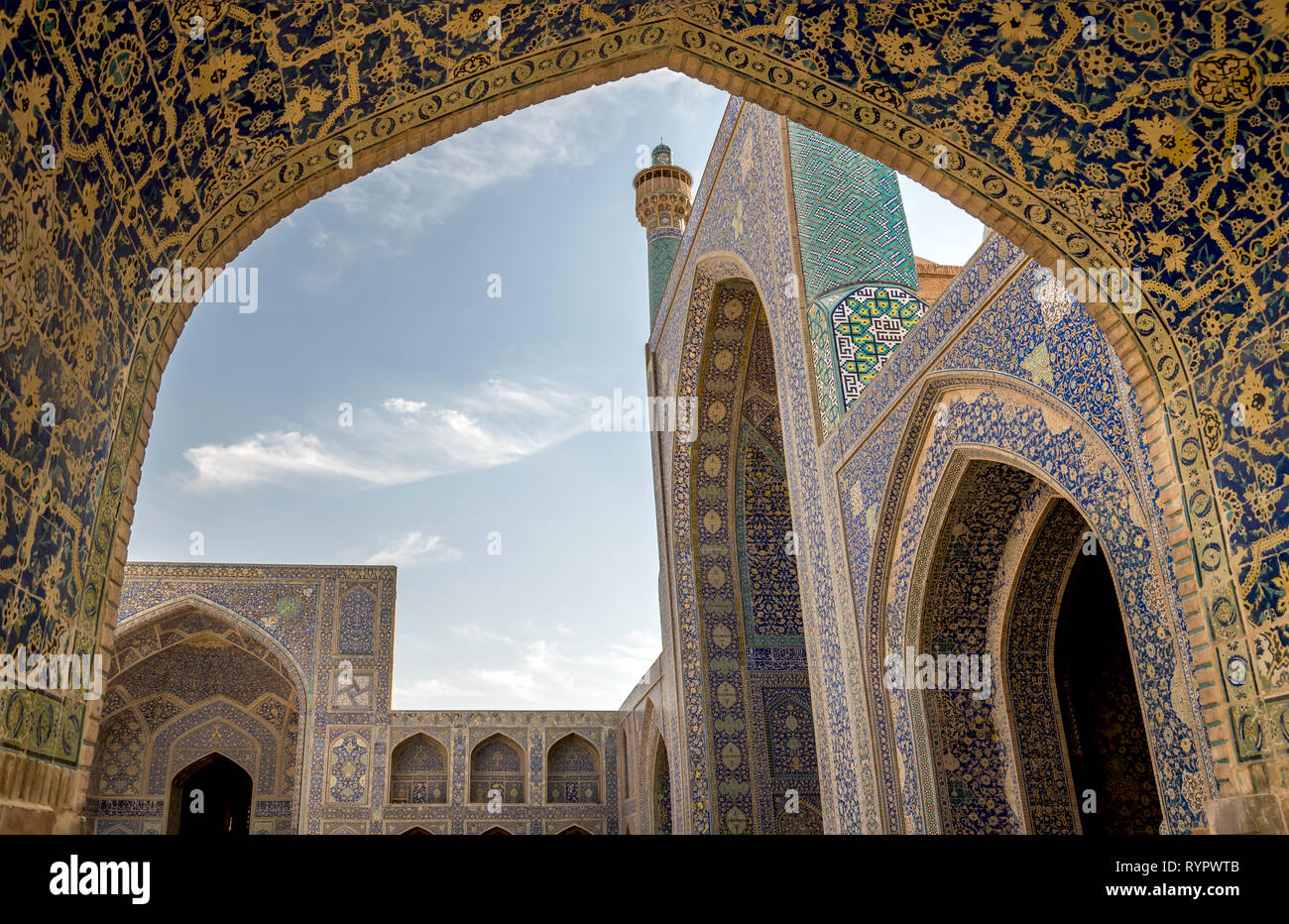 View of New Shah Abbas Mosque from arcade to courtyard with madrasa and iwan, Esfahan, Iran Stock Photo