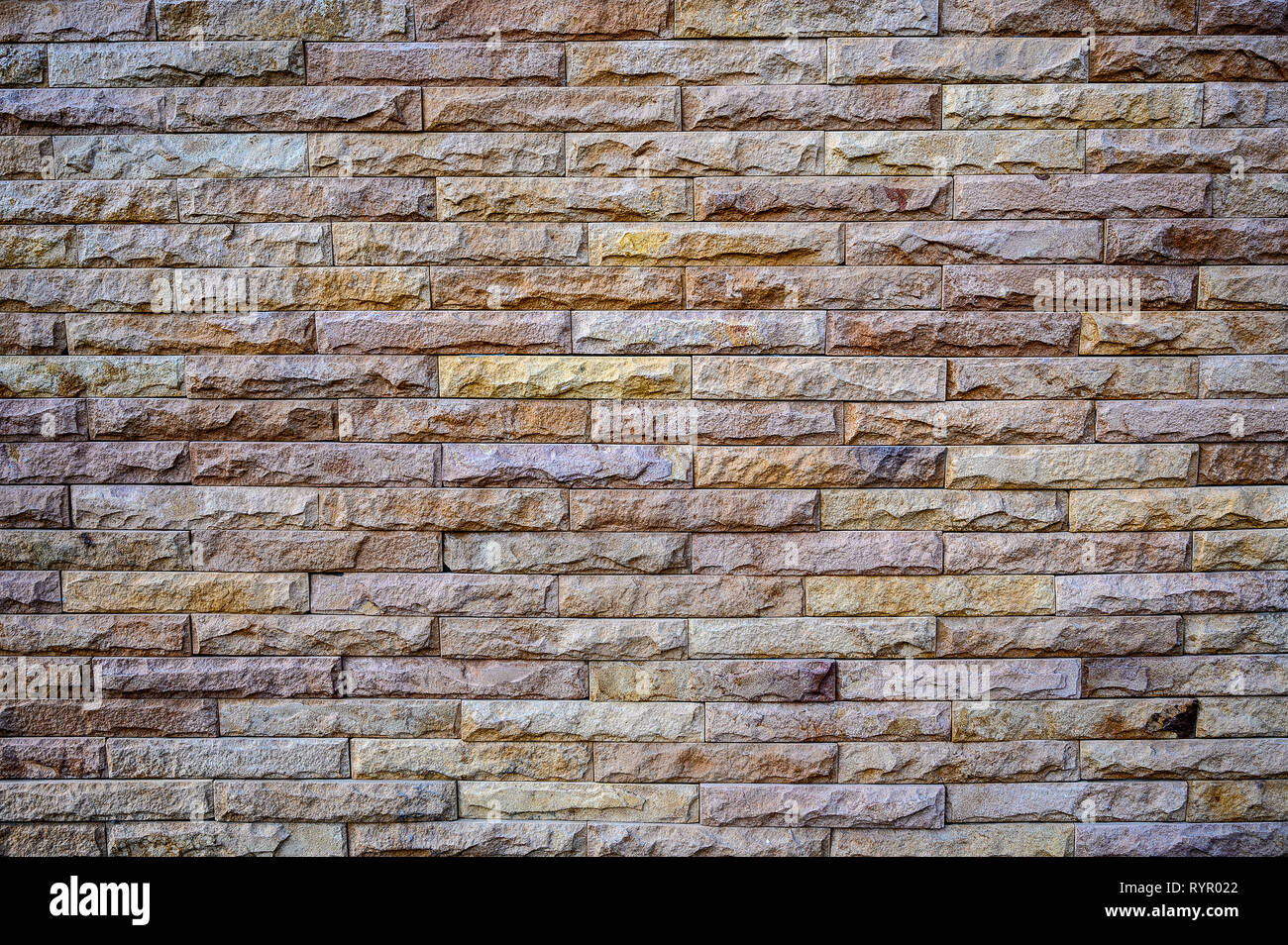 Old brown stone bricks wall pattern background of brick wall Stock Photo