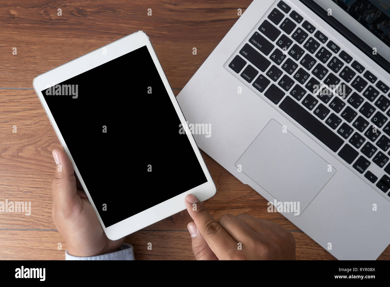 Man hand holding the black smartphone screen mockup Stock Photo
