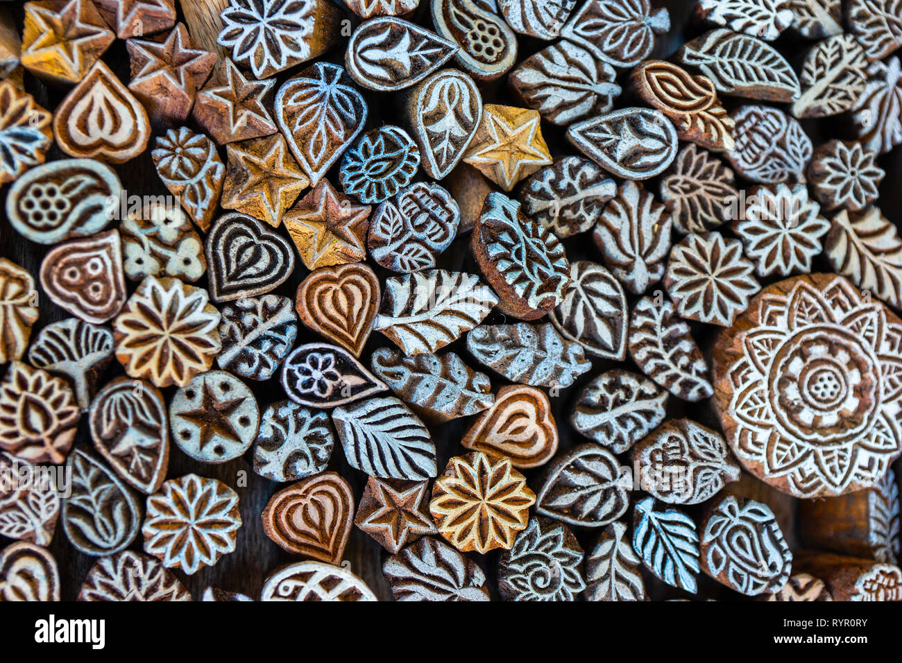 A pattern of handmade decorative ornaments made of carved wood. Unique  background for a design project Stock Photo - Alamy