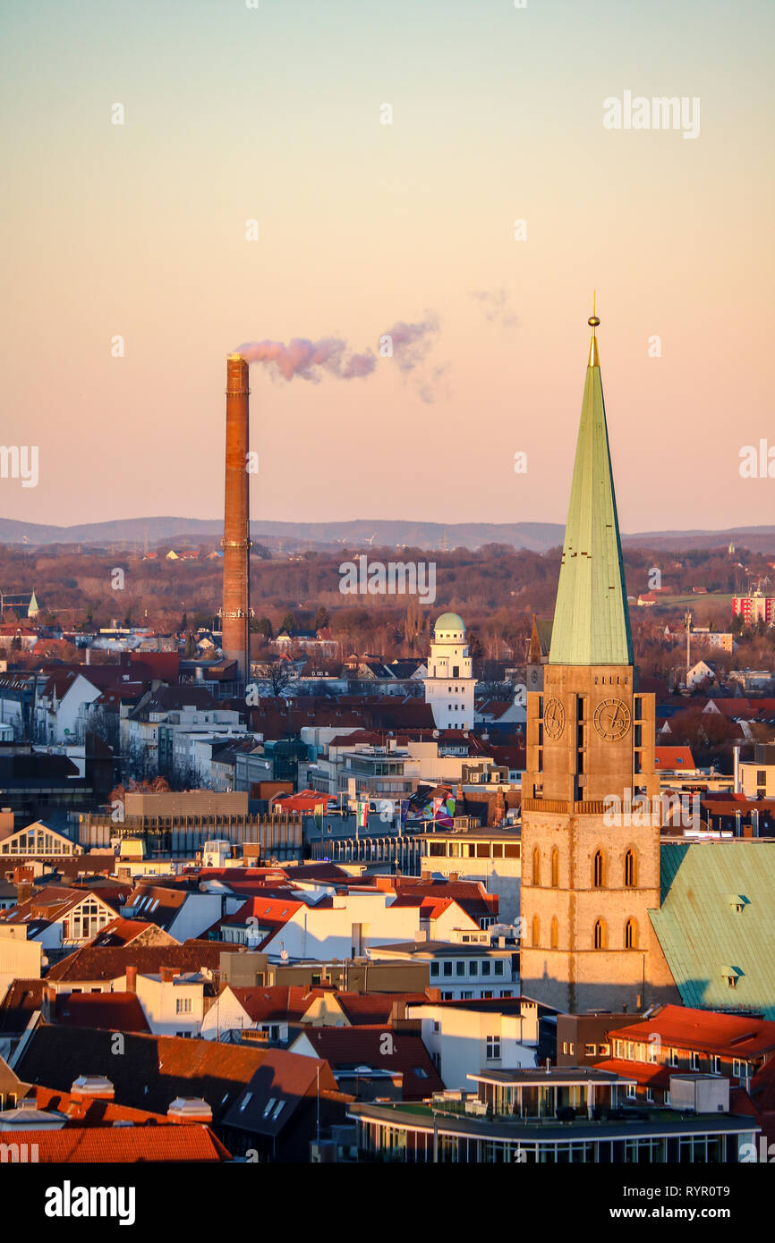 Panorama of Bielefeld, Germany with the Nikolaikirche and a smoking chimney Stock Photo