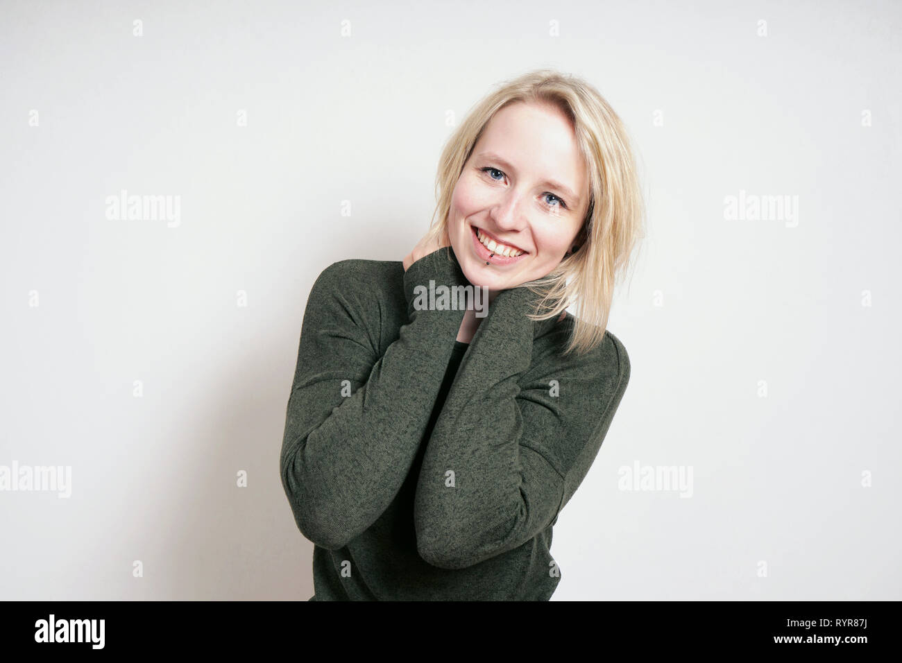 happy blond young woman with big toothy smile Stock Photo - Alamy