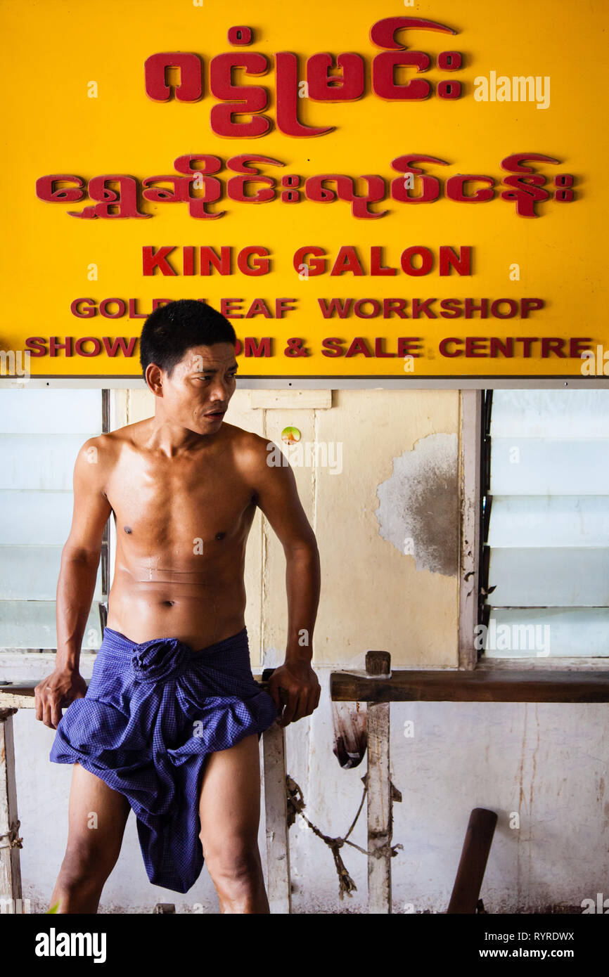 Workers create gold leaf at the King Galon gold leaf in