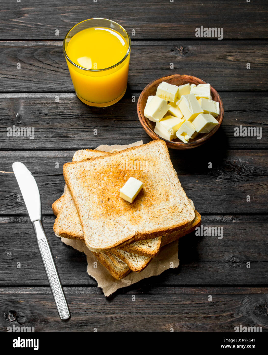 Toasted Bread With Butter And Orange Juice On A Wooden Background Stock Photo Alamy Toasted Bread With Butter And Orange Juice On A Wooden Background Stock Photo Alamy