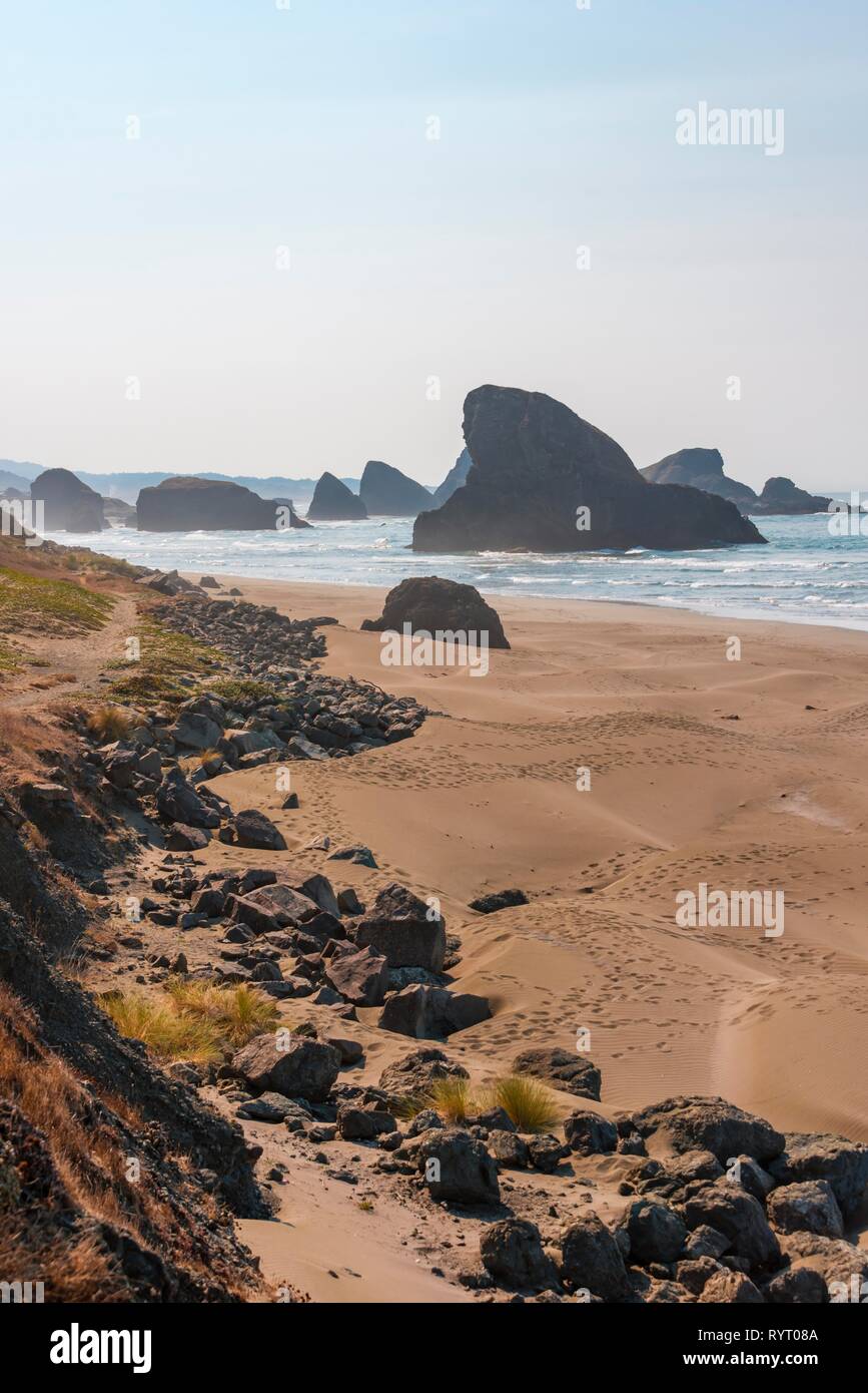 Coastal landscape, sandy beach with rugged rocks, Myers Creek Beach