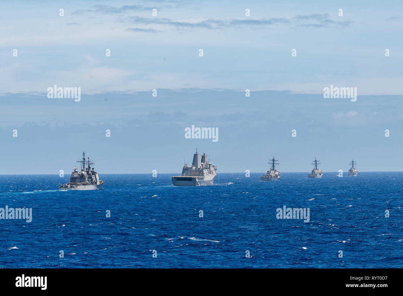190314-N-WI365-1153 PACIFIC OCEAN (March 14, 2019) – The amphibious dock landing ship USS Ashland (LSD 48) sails behind a formation during a training exercise with other U.S. Navy warships. U.S. Navy warships train together to increase the tactical proficiency, lethality, and interoperability of participating units in an Era of Great Power Competition. (U.S. Navy photo by Mass Communication Specialist 2nd Class Markus Castaneda) Stock Photo