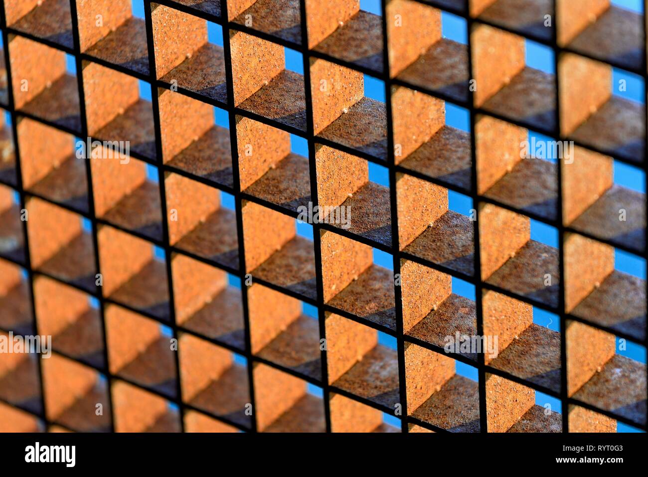 Rusty grid against a blue sky, background image, Germany Stock Photo