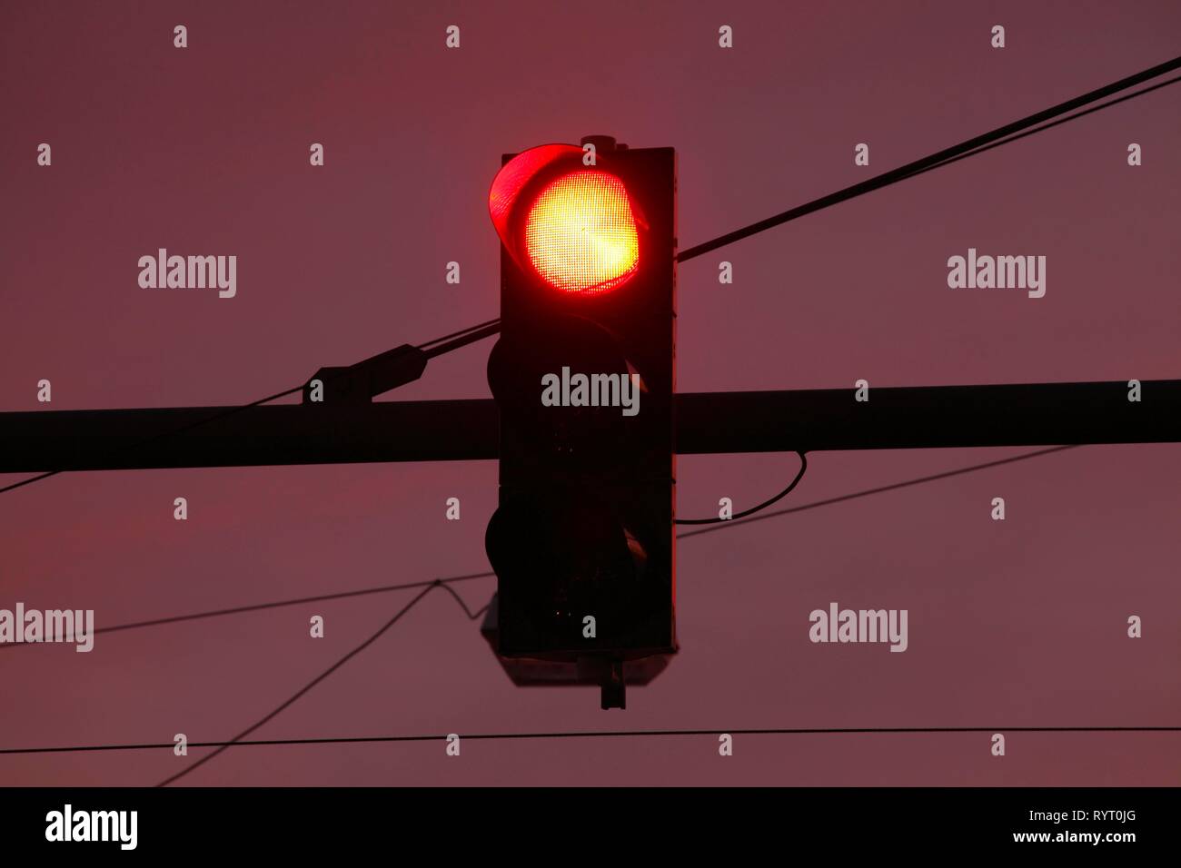 Traffic light shows red at dusk, Germany Stock Photo - Alamy