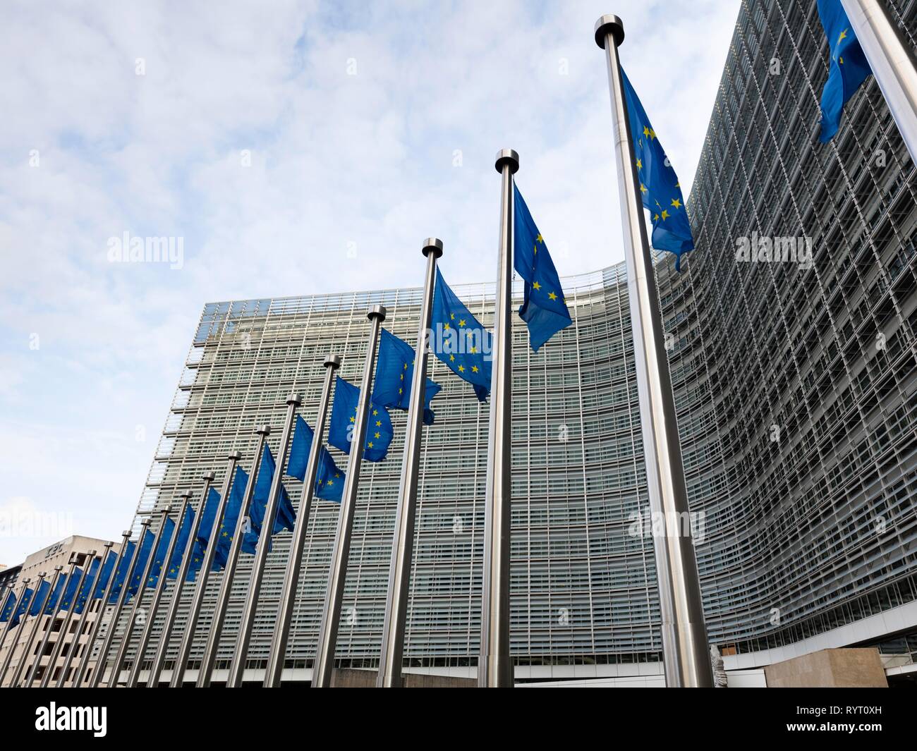 European flags in front of the Berlaymont building, headquarters of the European Commission, Europaviertel, Brussels, Belgium Stock Photo