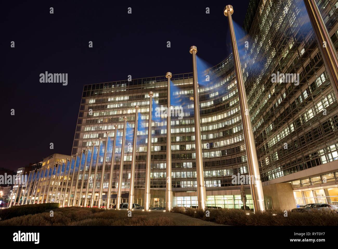 Europe flags in front of the Berlaymont building, seat of the European Commission, night shot, Europaviertel, Brussels, Belgium Stock Photo