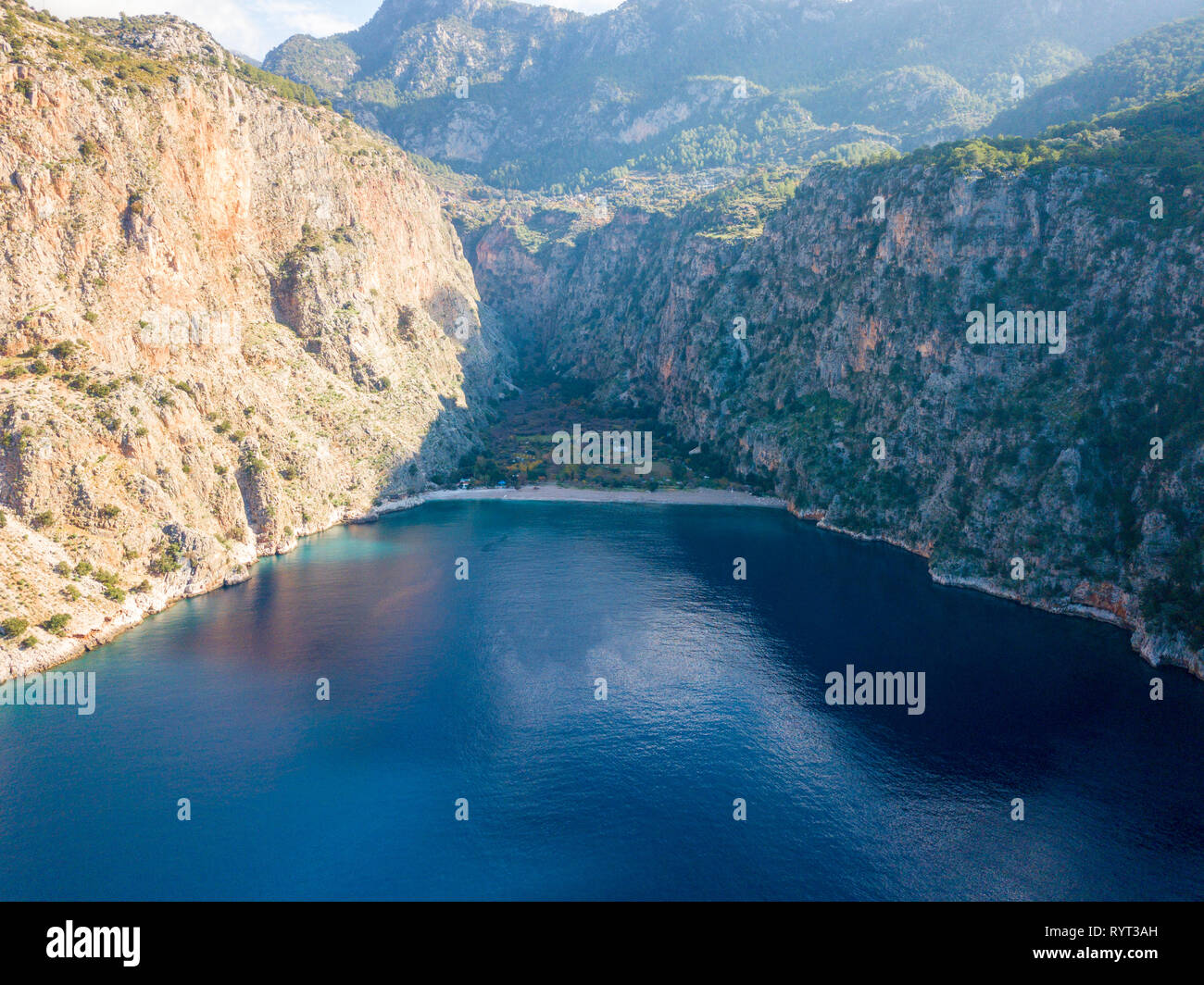 Straight in aerial drone view of the beach and ocean of Butterfly Valley in Fethiye, Turkey Stock Photo