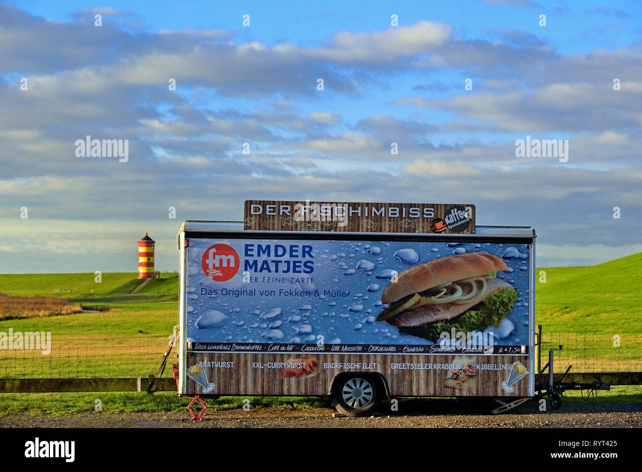 Closed fish snack car stands on the car park in front of the Pilsum lighthouse, Pilsum, East Frisia, Lower Saxony, Germany Stock Photo