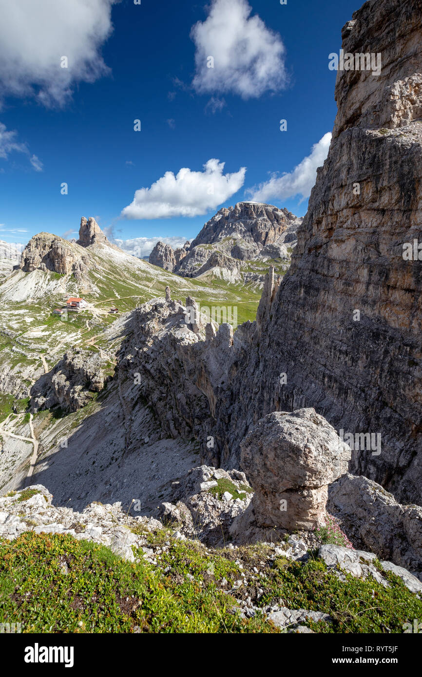 Mountain wall of Monte Paterno. In background Sasso di Sesto, Torre di Toblin mountains. The Locatelli alpine refuge. The Sexten Dolomites. Italy. Stock Photo