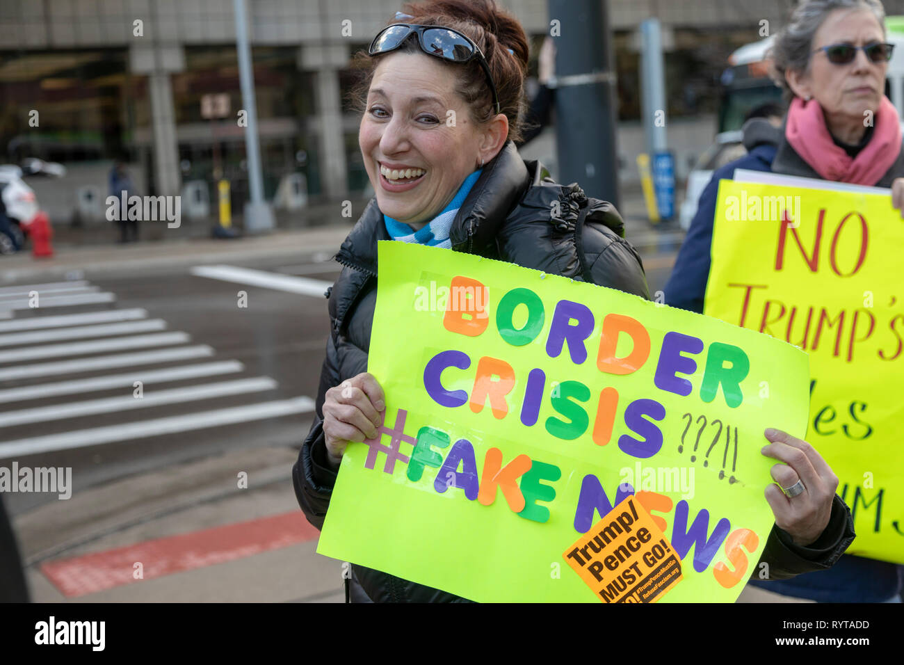 Detroit, Michigan USA - 14 March 2019 - Protesters picketed outside as immigration hard liners held a public meeting to promote construction of a wall along the Mexican border. The 'We Build the Wall' event promoted an organization of the same name that is trying to raise individual contributions to fund wall construction. Credit: Jim West/Alamy Live News Stock Photo