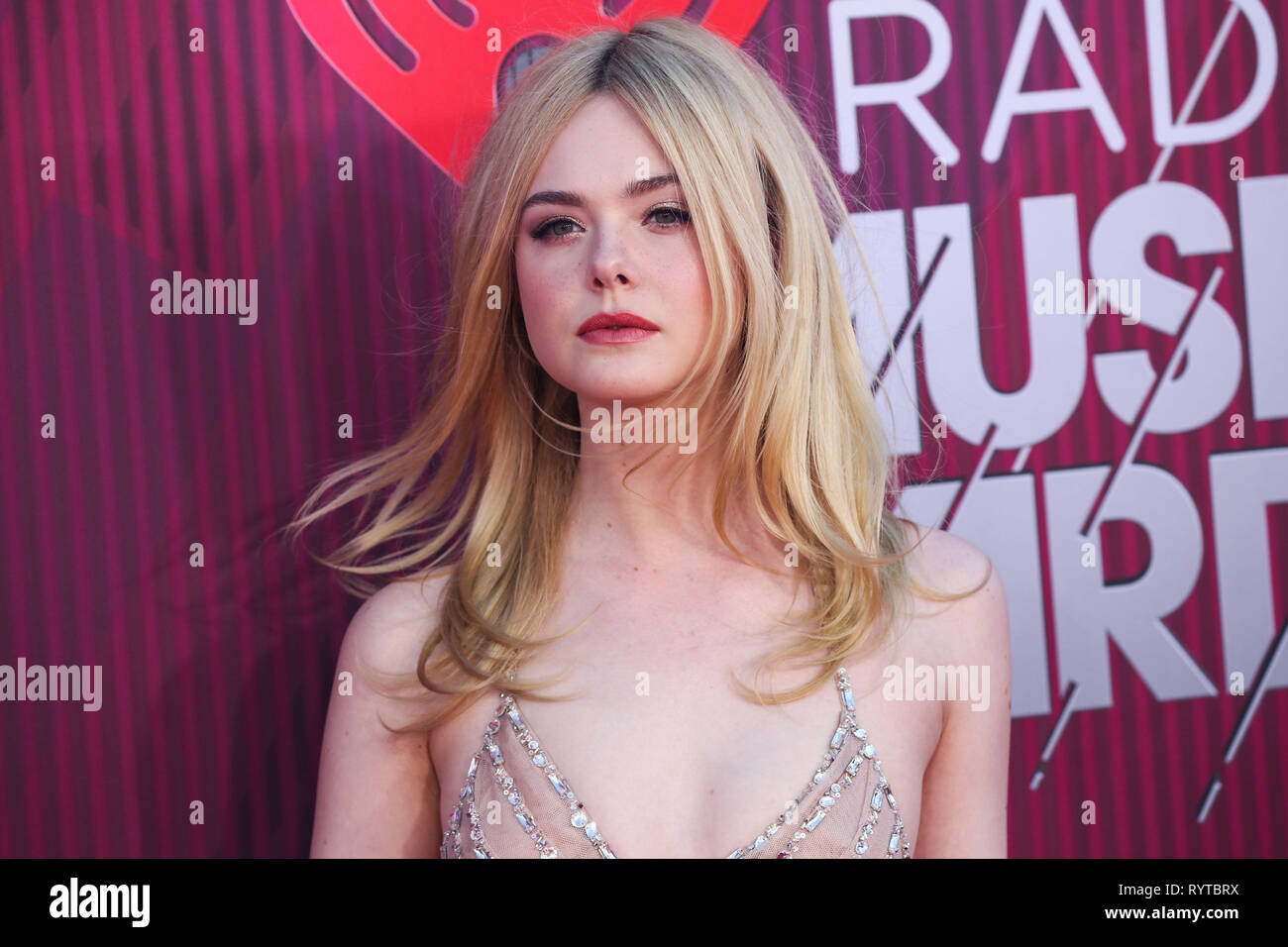 LOS ANGELES, CA, USA - MARCH 14: Actress Elle Fanning wearing a 