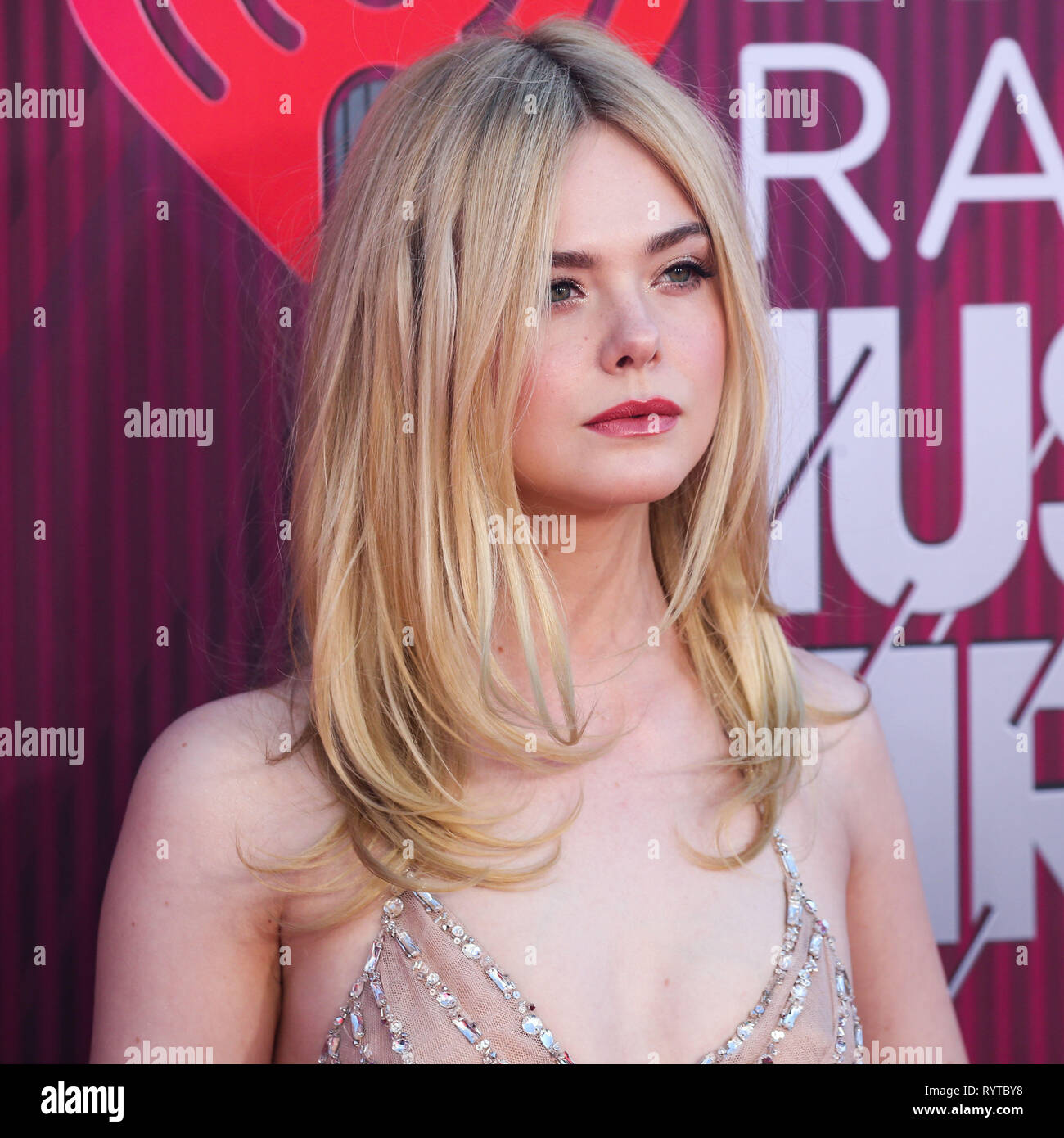 LOS ANGELES, CA, USA - MARCH 14: Actress Elle Fanning wearing a Miu Miu gown and Tiffany jewels arrives at the 2019 iHeartRadio Music Awards held at Microsoft Theater at L.A. Live on March 14, 2019 in Los Angeles, California, United States. (Photo by Xavier Collin/Image Press Agency) Stock Photo