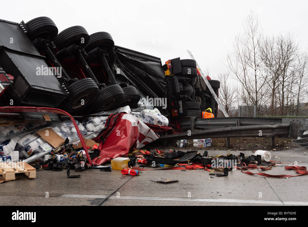 Rostock, Germany. 15th May, 2019. A car is stuck in a hole in a road after  a burst water pipe. Due to a burst water pipe on Wednesday in the east of